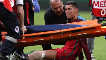 PARIS, FRANCE - JULY 10:  Cristiano Ronaldo of Portugal reacts to an injury during the UEFA Euro 2016 Final match between Portugal and France at Stade de France on July 10, 2016 in Paris, France.  (Photo by Matthew Ashton - AMA/Getty Images)