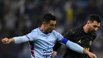 RIYADH, SAUDI ARABIA - JANUARY 19: Leo Messi of Paris Saint-Germain and Cristiano Ronaldo of Ruyadh XI fight for possession during the friendly match between Paris Saint-Germain and Riyadh XI at King Fahd International Stadium on January 19, 2023 in Riyadh, Saudi Arabia. (Photo by Aurelien Meunier - PSG/PSG via Getty Images)