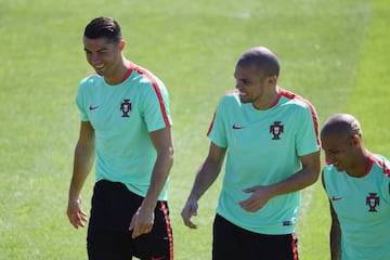 Pepe (centre) shares a joke with Cristiano Ronaldo (left) and Ricardo Quaresma as Portugal prepare for the Euro 2016 final.