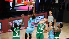 Aug 4, 2020; Lake Buena Vista, Florida, USA;  Miami Heat forward Bam Adebayo (13) dunks against Boston Celtics forward Gordon Hayward (20) and guard Jaylen Brown (7) in the first half of a NBA basketball game at the Visa Athletic Center in the ESPN Wide World of Sports Complex. Mandatory Credit: Kim Klement-USA TODAY Sports