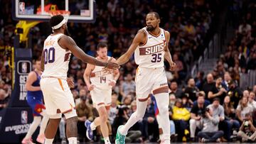 DENVER, COLORADO - MARCH 5: Kevin Durant #35 and Royce O'Neale #00 of the Phoenix Suns celebrate a basket against the Denver Nuggets at Ball Arena on March 5, 2024 in Denver, Colorado. NOTE TO USER: User expressly acknowledges and agrees that, by downloading and/or using this Photograph, user is consenting to the terms and conditions of the Getty Images License Agreement. Jamie Schwaberow/Getty Images/AFP (Photo by Jamie Schwaberow / GETTY IMAGES NORTH AMERICA / Getty Images via AFP)