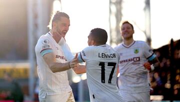 26 February 2022, United Kingdom, London: Burnley's Aaron Lennon and Jay Rodriguez celebrate after Crystal Palace's Luka Milivojevic (Not Pictured) scores an own goal during the English Premier League soccer match between Crystal Palace and Burn