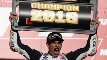 MotoGP - Japanese Grand Prix - Twin Ring Motegi, Motegi, Japan - October 21, 2018 Repsol Honda&#039;s Marc Marquez celebrates winning the MotoGP race and the MotoGP world title on the podium REUTERS/Toru Hanai