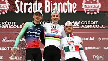 TOPSHOT - (From L) Second placed UCI WorldTeam Decathlon CMA CGM's French Paul Seixas, first placed UAE Team Emirates's Slovenian Tadej Pogacar and third placed Del UAE Team Emirates XRG's MexicanIsaac Del Toro Romero celebrate on the podium after competing in the 20th one-day classic 'Strade Bianche' (White Roads) men's cycling race between Siena and Siena in Tuscany on March 7, 2026. (Photo by Marco BERTORELLO / AFP)