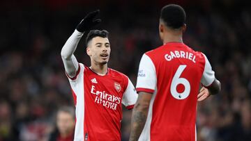 LONDON, ENGLAND - DECEMBER 15: Gabriel Martinelli celebrates with teammate Gabriel Magalhaes of Arsenal after scoring their team's first goal during the Premier League match between Arsenal and West Ham United at Emirates Stadium on December 15, 2021