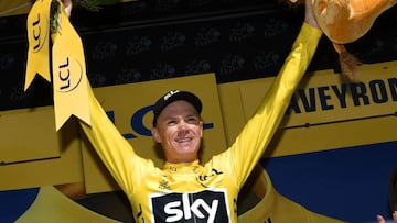 Great Britain&#039;s Christopher Froome celebrates his overall leader yellow jersey on the podium at the end of the 181,5 km fourteenth stage of the 104th edition of the Tour de France cycling race on July 15, 2017 between Blagnac and Rodez.