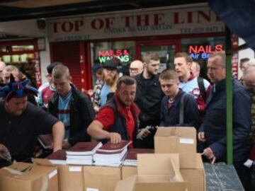 West Ham fans buy programmes near the Boleyn Ground. Tonights Premier League match against Manchester United is West Ham United's last game at the Boleyn Ground, bringing to an end 112 years of the club's history at the ground. The club will move into the