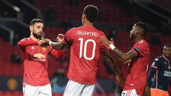 MANCHESTER, ENGLAND - NOVEMBER 24: Marcus Rashford of Manchester United celebrates after scoring their sides third goal with Bruno Fernandes (L)  and Fred (R) during the UEFA Champions League Group H stage match between Manchester United and İstanbul Basa