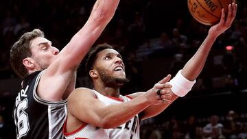 Apr 10, 2017; Portland, OR, USA; Portland Trail Blazers guard Evan Turner (1) shoots the ball past San Antonio Spurs center Pau Gasol (16) during the second half of the game at Moda Center. The Blazers won 99-98. Mandatory Credit: Steve Dykes-USA TODAY Sp