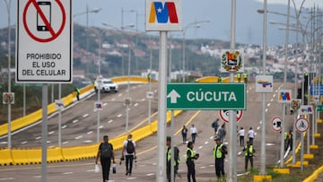 People belonging to the army, as well as maintenance personnel, among others, are seen walking along the Atanasio Girardot binational bridge. Tienditas, January 01, 2023. Located between the border crossings of Colombia and Venezuela, the binational infrastructure, renamed the Atanasio Girardot Bridge, was the epicenter of the years of tensions that preceded the reestablishment of relations and will be reopened for the crossing of vehicles, as well as merchandise and people. 240 meters long and 40 meters wide, this bridge has lanes for cargo trucks, cars, pedestrians and bicycles.
(Photo by Jorge Mantilla/NurPhoto via Getty Images)