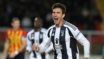 Juventus' Italian defender #27 Andrea Cambiaso celebrates after scoring the opening goal during the Italian Serie A football match between US Lecce and Juventus FC at the Via del Mare Stadium in Lecce on December 1, 2024. (Photo by CARLO HERMANN / AFP)