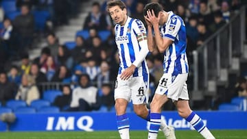 Real Sociedad's Spanish midfielder Mikel Oyarzabal (L) and Real Sociedad's Spanish forward Carlos Fernandez react during the Spanish League football match between Real Sociedad and Cadiz CF at the Reale Arena stadium in San Sebastian on March 3, 2023. (Photo by ANDER GILLENEA / AFP) (Photo by ANDER GILLENEA/AFP via Getty Images)