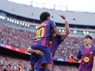 Barcelona's Spanish forward #07 Ferran Torres celebrates with Barcelona's Spanish forward #10 Lamine Yamal scoring his team's second goal during the Spanish league football match between FC Barcelona and RCD Espanyol at the Camp Nou stadium in Barcelona on April 11 , 2026. (Photo by Josep LAGO / AFP)