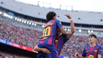 Barcelona's Spanish forward #07 Ferran Torres celebrates with Barcelona's Spanish forward #10 Lamine Yamal scoring his team's second goal during the Spanish league football match between FC Barcelona and RCD Espanyol at the Camp Nou stadium in Barcelona on April 11 , 2026. (Photo by Josep LAGO / AFP)