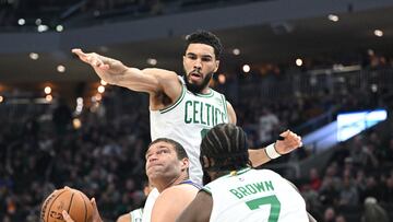 Mar 30, 2023; Milwaukee, Wisconsin, USA; Milwaukee Bucks center Brook Lopez (11) puts up a shot against Boston Celtics guard Jaylen Brown (7) in the first quarter at Fiserv Forum. Mandatory Credit: Michael McLoone-USA TODAY Sports