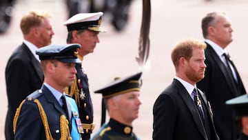 LONDON, ENGLAND - SEPTEMBER 19: Prince William, Prince of Wales and Prince Harry, Duke of Sussex follow behind The Queen's funeral cortege borne on the State Gun Carriage of the Royal Navy as it leaves Westminster Abbey on September 19, 2022 in London, England. Elizabeth Alexandra Mary Windsor was born in Bruton Street, Mayfair, London on 21 April 1926. She married Prince Philip in 1947 and ascended the throne of the United Kingdom and Commonwealth on 6 February 1952 after the death of her Father, King George VI. Queen Elizabeth II died at Balmoral Castle in Scotland on September 8, 2022, and is succeeded by her eldest son, King Charles III. (Photo by Dan Kitwood/Getty Images)
