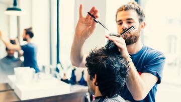 Man gets a haircut at his barber