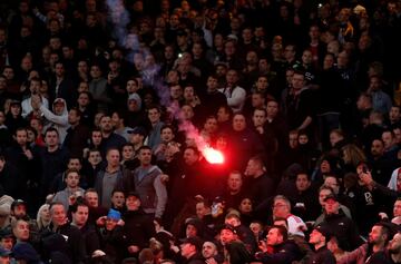 AEK Athens fans jumped onto the pitch and launched flares at the Ajax fans in the Champions League game in Greece on Tuesday night, causing police to intervene.