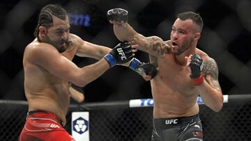 Colby Covington golpea a Jorge Masvidal durante el UFC 272.