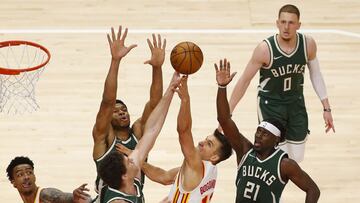 ATLANTA, GEORGIA - APRIL 25: Guard Bogdan Bogdanovic #13 of the Atlanta Hawks shoots over center Brook Lopez #11 and forward Giannis Antetokounmpo #34 of the Milwaukee Bucks during the game at State Farm Arena on April 25, 2021 in Atlanta, Georgia. NOTE TO USER: User expressly acknowledges and agrees that, by downloading and or using this photograph, User is consenting to the terms and conditions of the Getty Images License Agreement. Michael Zarrilli/Getty Images/AFP
== FOR NEWSPAPERS, INTERNET, TELCOS & TELEVISION USE ONLY ==