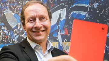 Hellmut Krug, project leader for the video assistant referee (VAR) at the German Football Association (DFB) and German Football League (DFL) showing the red card in Hamburg.