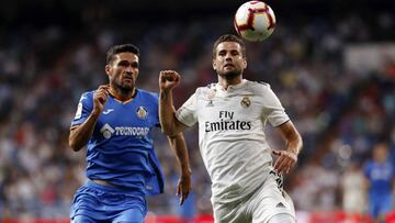 Nacho pugna con Molina en el partido entre Real Madrid y Getafe.