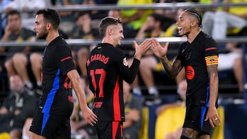 VILLARREAL, SPAIN - SEPTEMBER 22: Raphinha of FC Barcelona celebrates scoring his team's fifth goal with teammate Marc Casado during the LaLiga match between Villarreal CF and FC Barcelona at Estadio de la Ceramica on September 22, 2024 in Villarreal, Spain. (Photo by David Ramos/Getty Images)