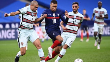 Portugal&#039;s defender Pepe (L) vies with France&#039;s forward Kylian Mbappe (C) during the Nations League football match between France and Portugal, on October 11, 2020 at the Stade de France in Saint-Denis, outside Paris. (Photo by FRANCK FIFE / AFP)