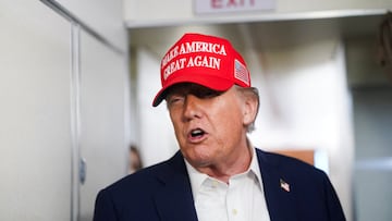 U.S. President Donald Trump speaks to members of the media on board Air Force One on the way to New Jersey, U.S., July 4, 2025. REUTERS/Nathan Howard