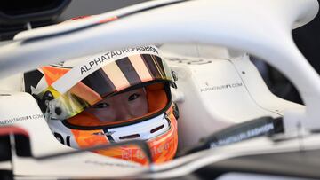 AlphaTauri's Japanese driver Yuki Tsunoda sits in his car in the pits during the first practice session at the Red Bull Ring race track in Spielberg, Austria, on July 8, 2022, ahead of the Formula One Austrian Grand Prix. (Photo by Jure Makovec / AFP)