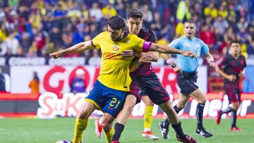 Henry Martin (L) of America fights for the ball with Rafael Fernandez (R) of Tijuana during the 13th round match between Tijuana and America as part of the Liga BBVA MX, Torneo Apertura 2024 at Caliente Stadium on October 23, 2024 in Tijuana, Baja California, Mexico.