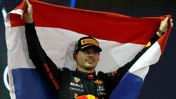 ABU DHABI, UNITED ARAB EMIRATES - DECEMBER 12: Race winner and 2021 F1 World Drivers Champion Max Verstappen of Netherlands and Red Bull Racing celebrates on the podium during the F1 Grand Prix of Abu Dhabi at Yas Marina Circuit on December 12, 2021 in Abu Dhabi, United Arab Emirates. (Photo by Joe Portlock - Formula 1/Formula 1 via Getty Images)