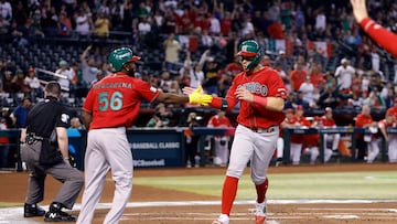 PHOENIX, ARIZONA - MARCH 15: Joey Meneses #32 high fives Randy Arozarena #56 of Team Mexico after scoring against Team Canada during the first inning of the World Baseball Classic Pool C game at Chase Field on March 15, 2023 in Phoenix, Arizona.   Chris Coduto/Getty Images/AFP (Photo by Chris Coduto / GETTY IMAGES NORTH AMERICA / Getty Images via AFP)