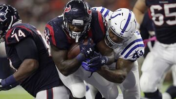 HOUSTON, TX - OCTOBER 16: Lamar Miller #26 of the Houston Texans carries Antonio Morrison #44 of the Indianapolis Colts across the goal line for a touchdown in the third quarter at NRG Stadium on October 16, 2016 in Houston, Texas.   Tim Warner/Getty Images/AFP
 == FOR NEWSPAPERS, INTERNET, TELCOS &amp; TELEVISION USE ONLY ==