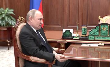 Russia's President Vladimir Putin attends a meeting with Defence Minister Sergei Shoigu in Moscow, 21 April 2022.