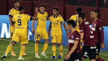 Argentina's Boca Juniors forward Carlos Tevez (C) celebrates with teammates after scoring a goal against Argentina's Lanus during an Argentina First Division 2020 football match at the Nestor Diaz Perez stadium, in Lanus, Buenos Aires province,