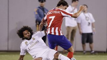 Real Madrid&#039;s Marcelo, left, fights for control with Atletico Madrid&#039;s Joao Felix during the second half of a soccer match Friday, July 26, 2019, in East Rutherford, N.J. (AP Photo/Frank Franklin II)