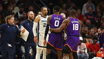 Dec 23, 2022; Phoenix, Arizona, USA; Memphis Grizzlies forward Dillon Brooks (left) argues with Phoenix Suns forward Torrey Craig in the first half at Footprint Center. Mandatory Credit: Mark J. Rebilas-USA TODAY Sports