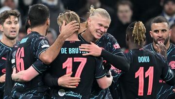 Manchester City's players celebrate during the UEFA Champions League round of 16, first-leg football match between FC Copenhagen and Manchester City in Copenhagen, Denmark, on February 13, 2024. (Photo by Jonathan NACKSTRAND / AFP)