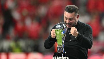 TOPSHOT - Toluca's Argentinian coach Antonio Mohamed gestures in front of the trophy during a ceremony for the Mexican Champions following the Liga MX Clausura football tournament second leg final between Toluca and America at the Nemesio Diez stadium in Toluca de Lerdo, state of Mexico, Mexico on May 25, 2025. (Photo by CARL DE SOUZA / AFP)