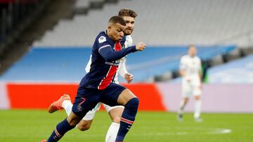 Soccer Football - Ligue 1 - Olympique de Marseille v Paris St Germain - Orange Velodrome, Marseille, France - February 7, 2021 Paris St Germain's Kylian Mbappe in action with Olympique de Marseille's Duje Caleta-Car REUTERS/Eric Gaillard