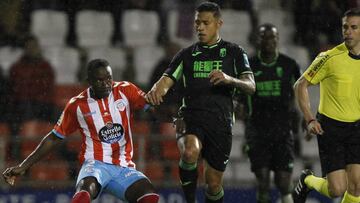 Jugadores del Granada y Lugo.