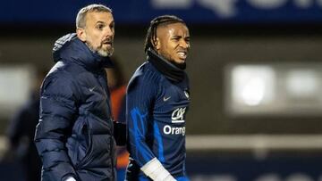 France's national football team forward Christopher Nkunku (R) reacts after being injured during a training session at the team's training camp in Clairefontaine-en-Yvelines, south of Paris, on November 15, 2022, five days ahead of the Qatar 2022 FIFA World Cup football tournament. (Photo by BERTRAND GUAY / AFP) (Photo by BERTRAND GUAY/AFP via Getty Images)