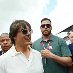 Tom Cruise gets in with the pit crew at the F1 Miami Grand Prix