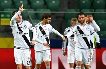 Radovic (L) celebrates his goal against Real Madrid.