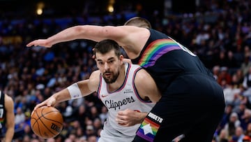 Jan 30, 2026; Denver, Colorado, USA; Los Angeles Clippers center Ivica Zubac (40) drives into Denver Nuggets center Nikola Jokic (15) in the first quarter at Ball Arena. Mandatory Credit: Isaiah J. Downing-Imagn Images