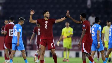Soccer Football - World Cup - AFC Asian Qualifiers - Group A - Qatar v India - Jassim Bin Hamad Stadium, Doha, Qatar - June 11, 2024 Qatar's Youssef Ayman celebrates with Ibrahim Al Hassan after the match REUTERS/Ibraheem Al Omari