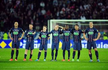 Ibrahimovic (right) looks on as PSG lose to Evian on penalties in 2013.