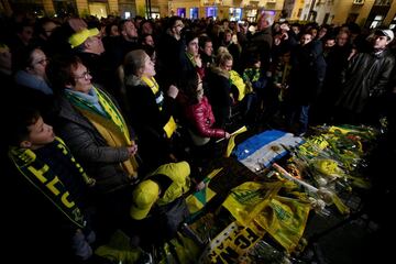 Fans gather near a row of yellow tulips in Nantes' city center after news that newly-signed Cardiff City soccer player Emiliano Sala was missing after the light aircraft he was travelling in disappeared between France and England the previous evening, acc