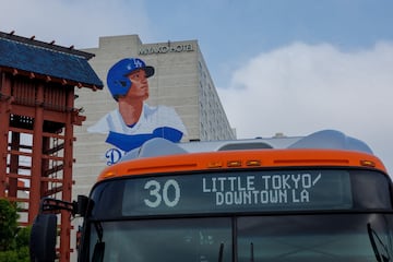 A giant mural of Shohei Ohtani, being painted by artist Robert Vargas on the side of a hotel in Little Tokyo, a neighborhood in downtown Los Angeles